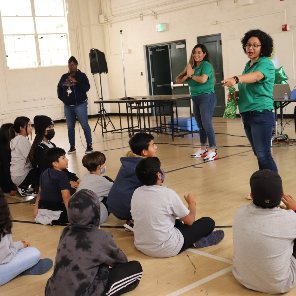 AltaMed staff speaking with students at South Gate middle school