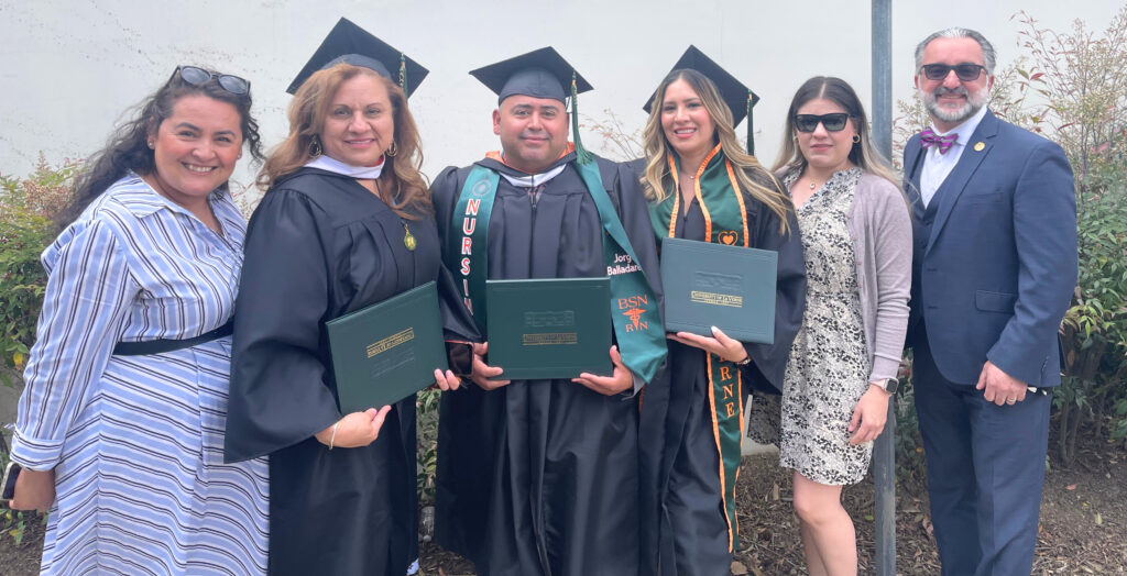 BSN Graduates posing with their degrees