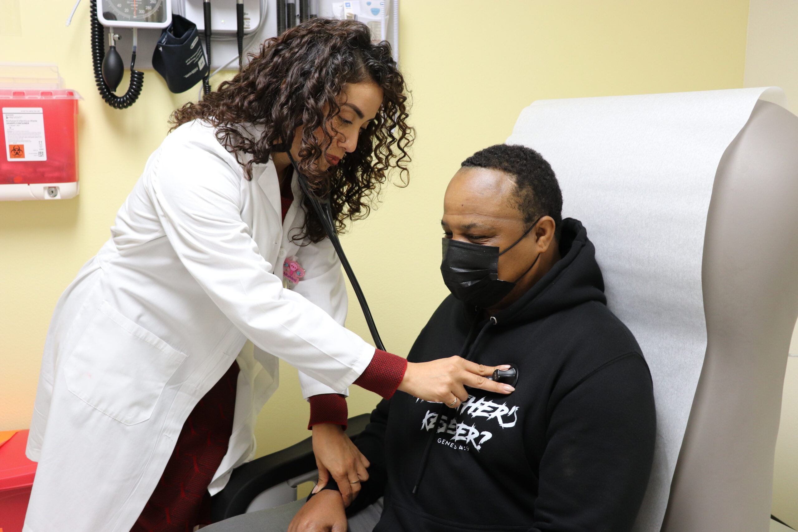 Doctor using a stethoscope on a patient