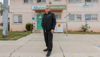 Man standing in front of a clinic