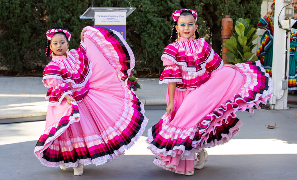 girls dancing in Mexican folkloric dancing dresses