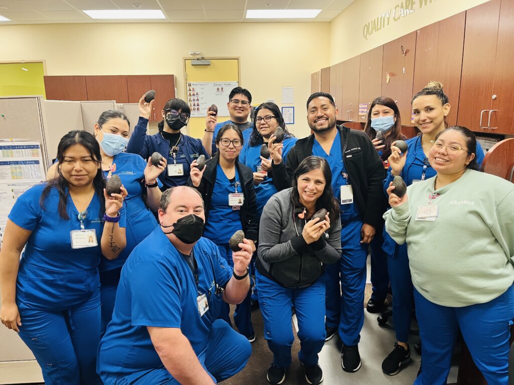 clinic staff holding avocados