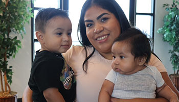 woman with two babies